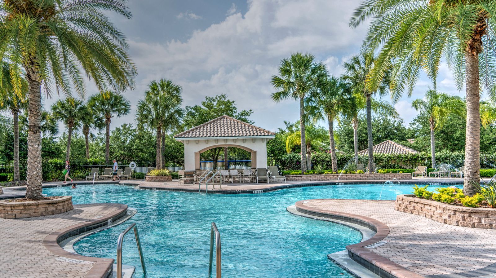 Resort pool framed by palms