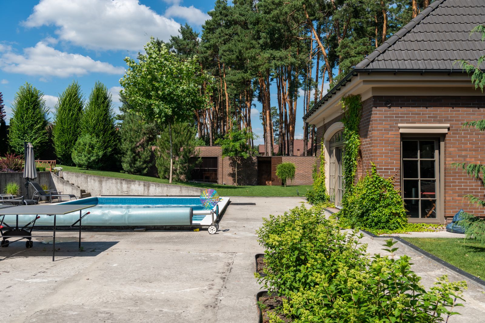 Covered backyard pool with poolhouse for seasonal closing