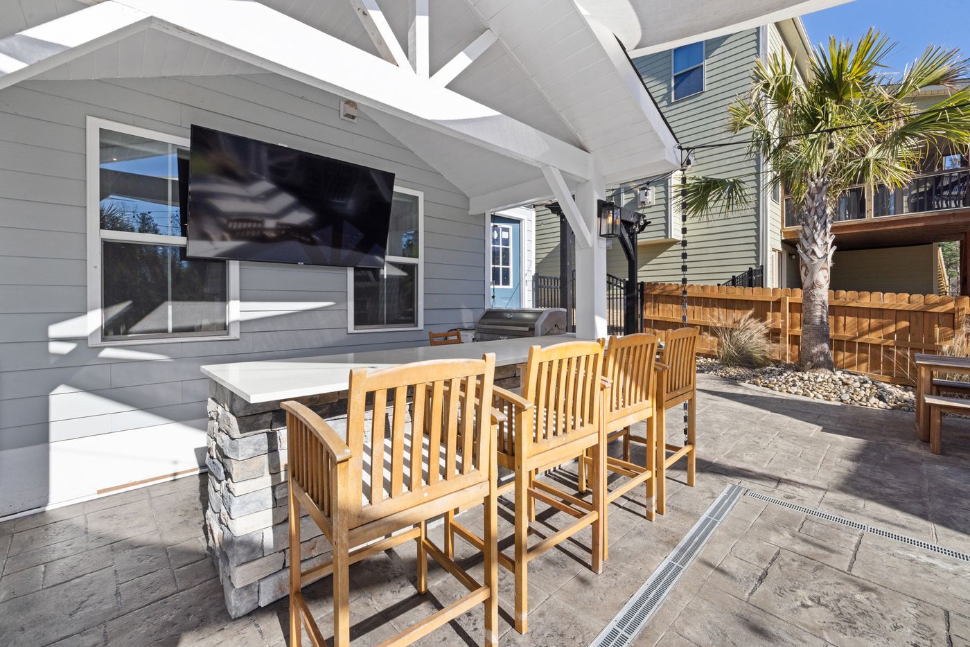 Covered patio with a gabled patio cover and outdoor seating