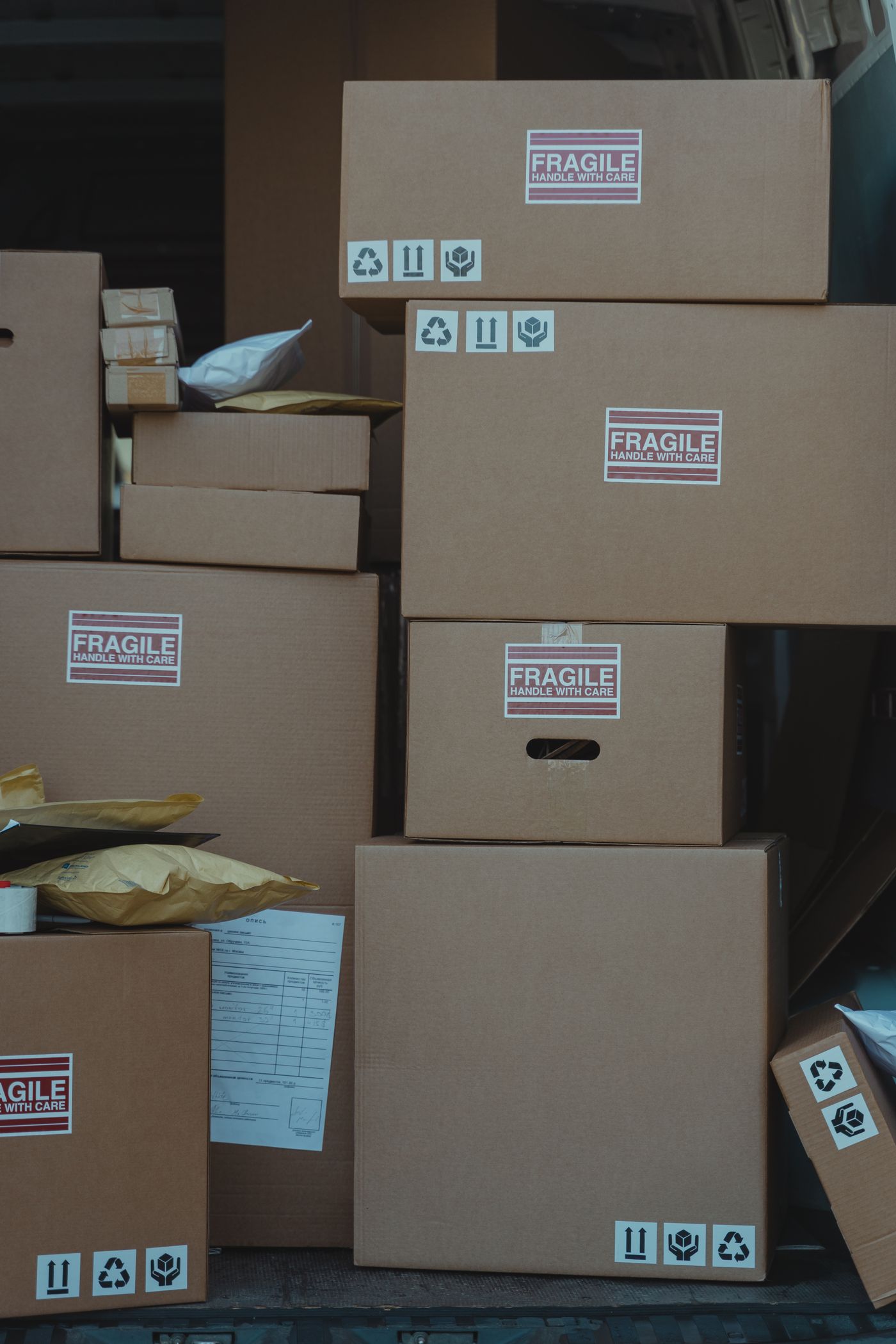 Hand-labelled moving boxes marked fragile, stacked carefully