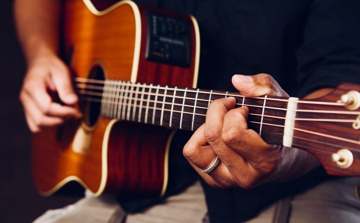 Acoustic guitar being played