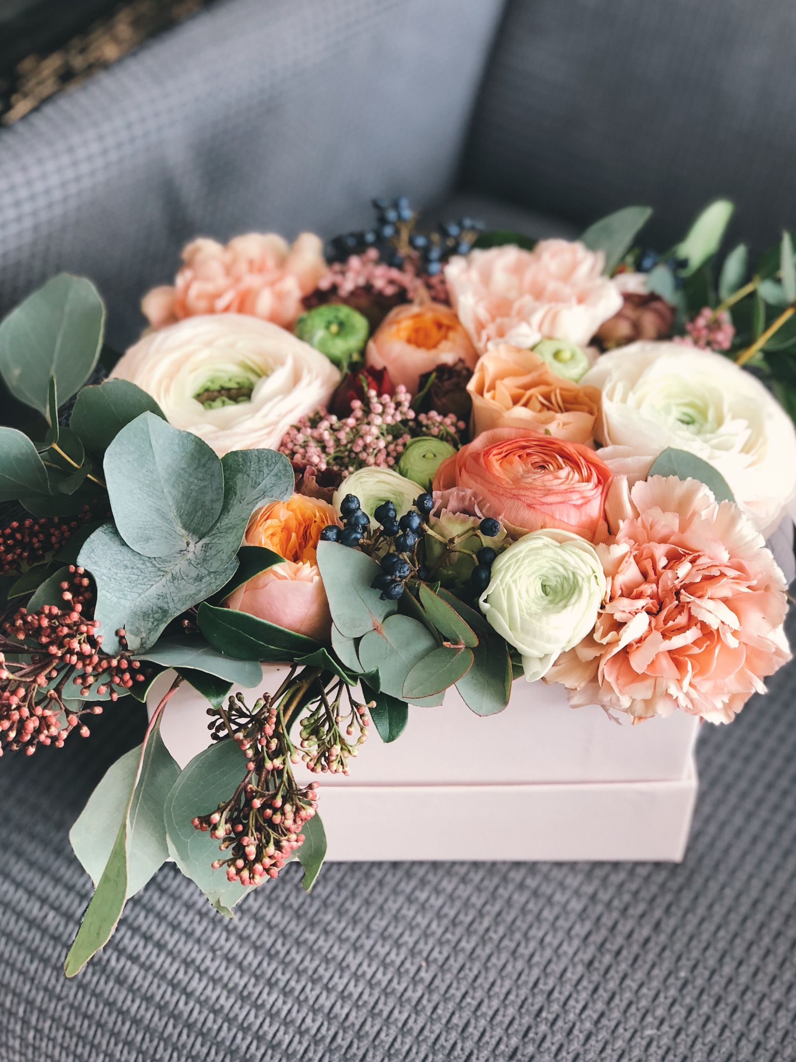 Hand-built seasonal flower arrangement in a soft palette
