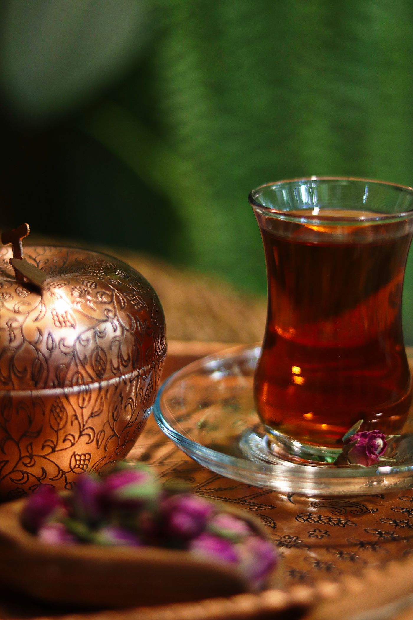 Persian tea in a glass with copper teapot