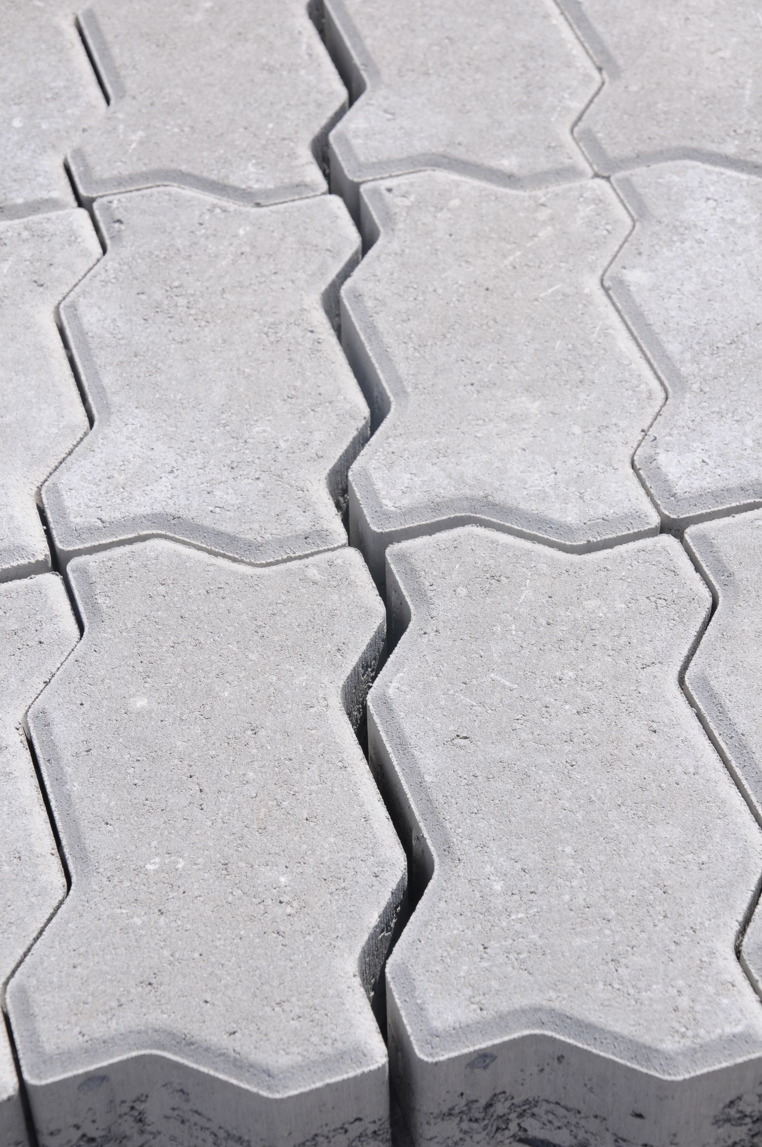 Interlocking paver courses laid in pattern