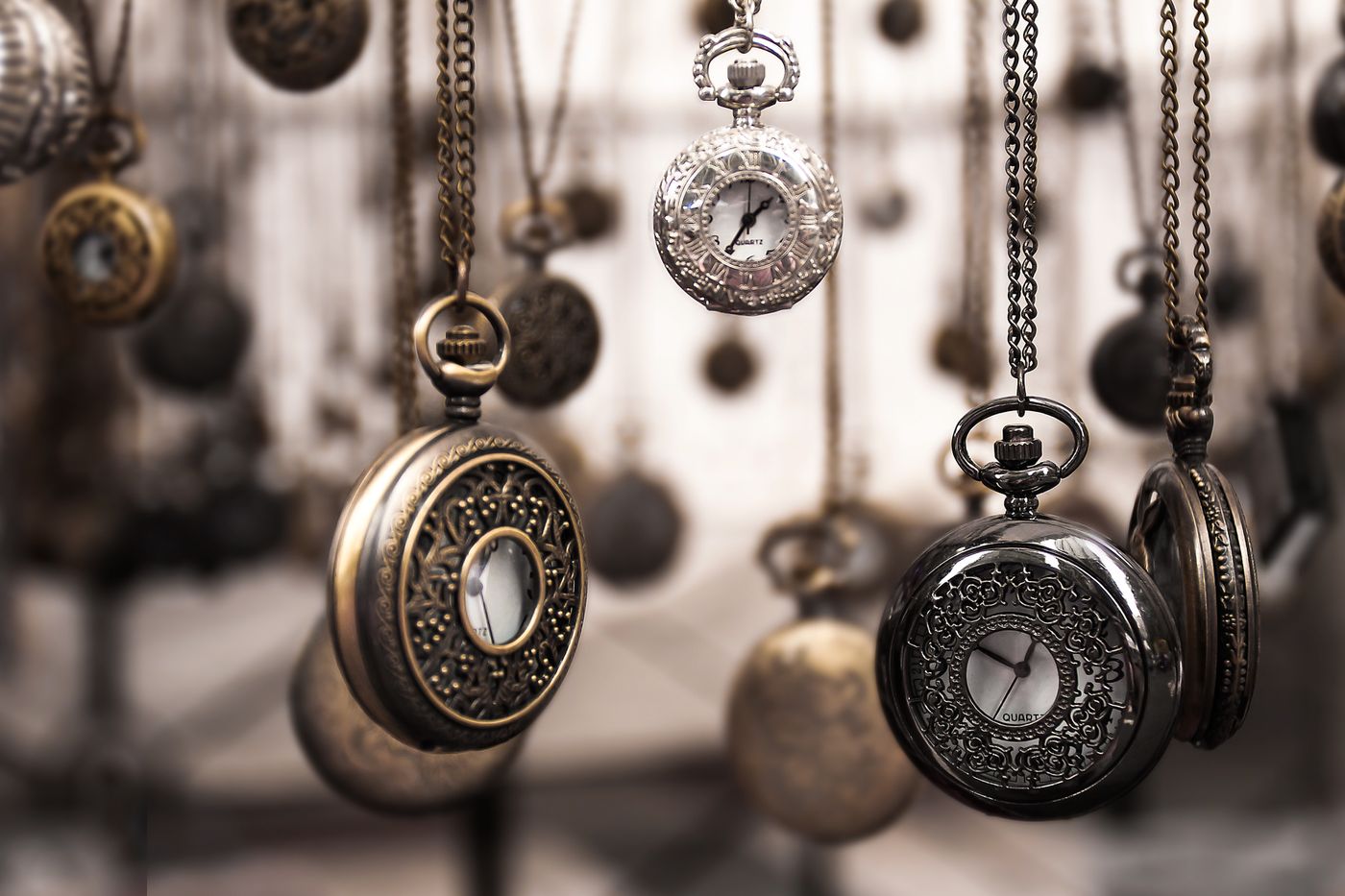 Vintage pocket watches hanging by the bench