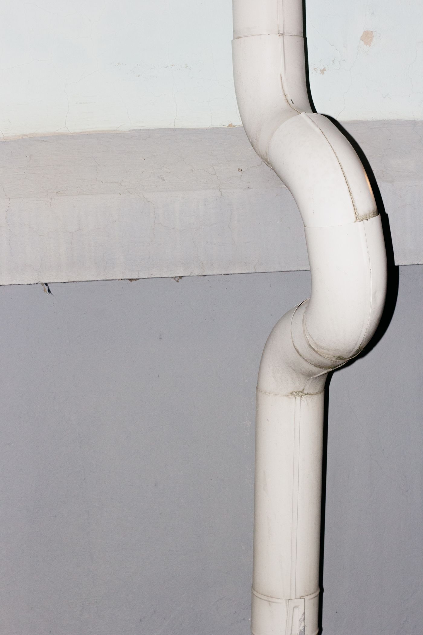 Downspout run along the eave
