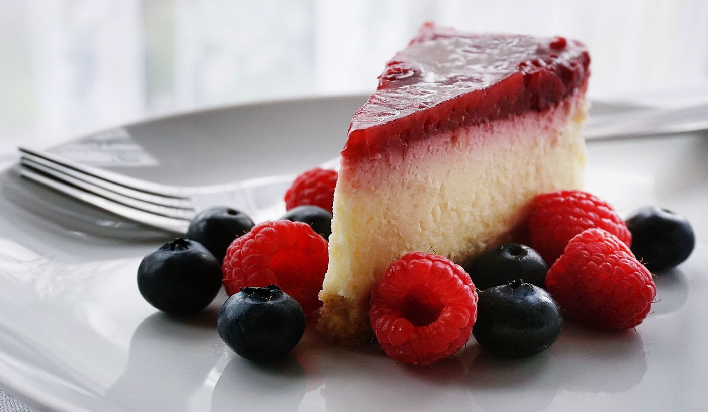 A berry-topped slice with fresh blueberries and raspberries