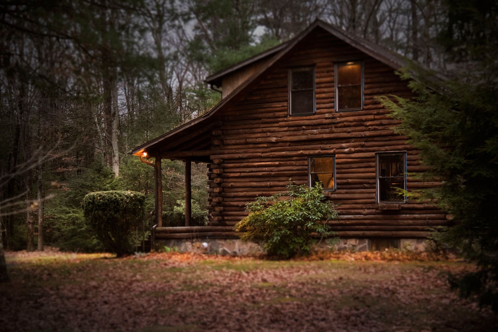 Home with steep grey shingle roof