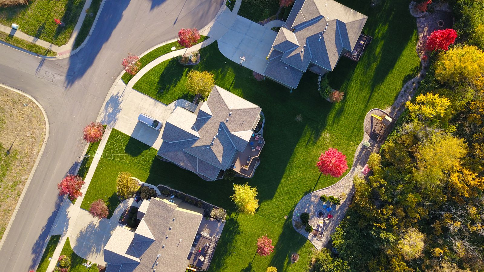 Aerial view of shingle rooftops across a neighbourhood