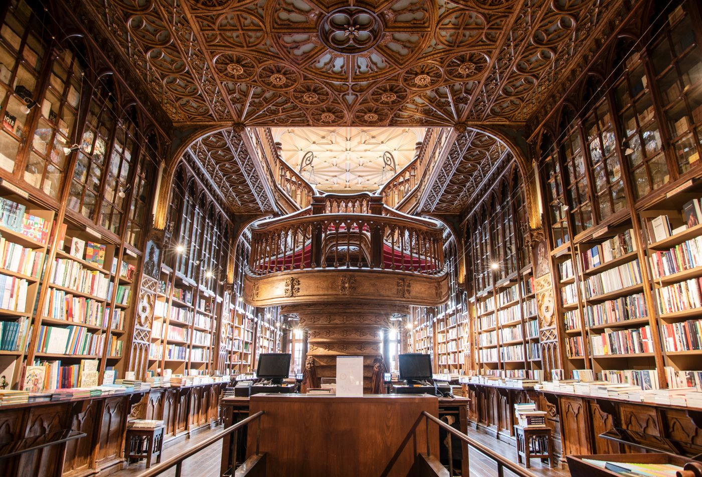 An ornate hall lined with books