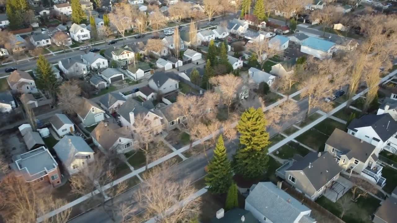 Aerial view of shingle rooftops across a residential neighbourhood