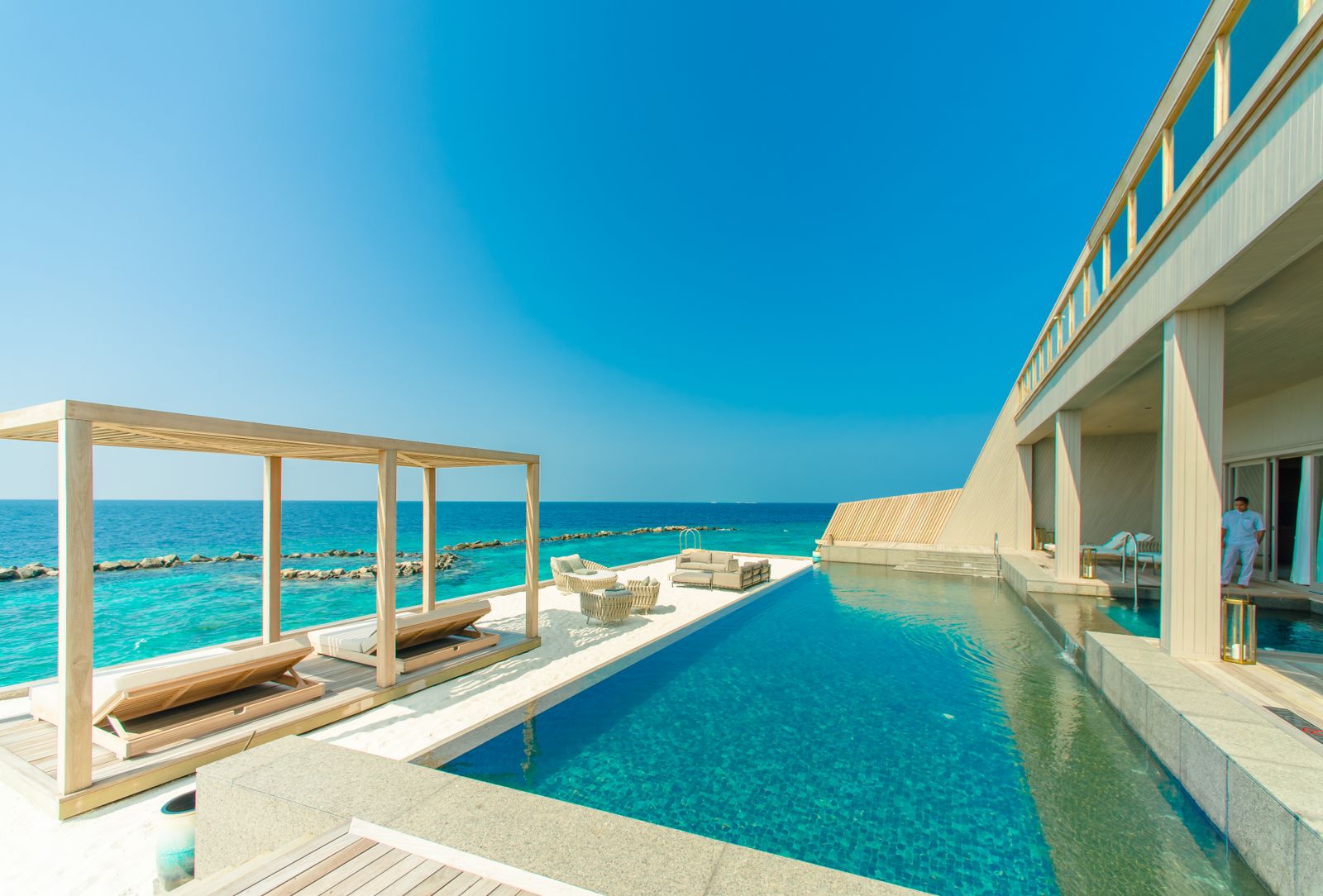Infinity-edge pool deck overlooking water