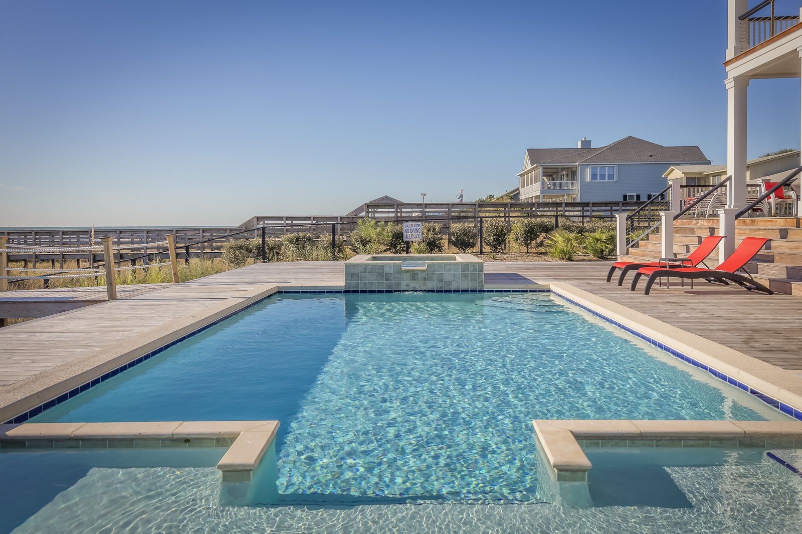 Residential backyard pool and spa with paver deck