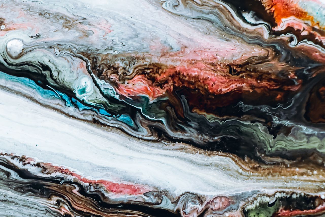 Metallic epoxy floor swirl pattern