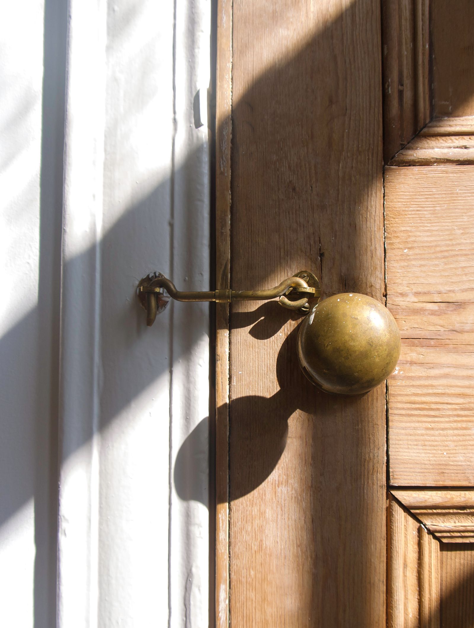 A brass latch and lock being rekeyed