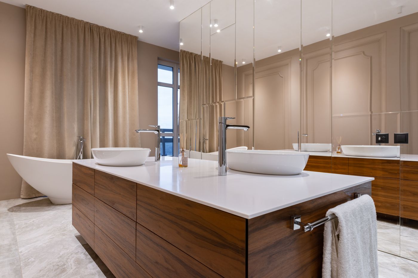 Clean finished bathroom with wooden vanity