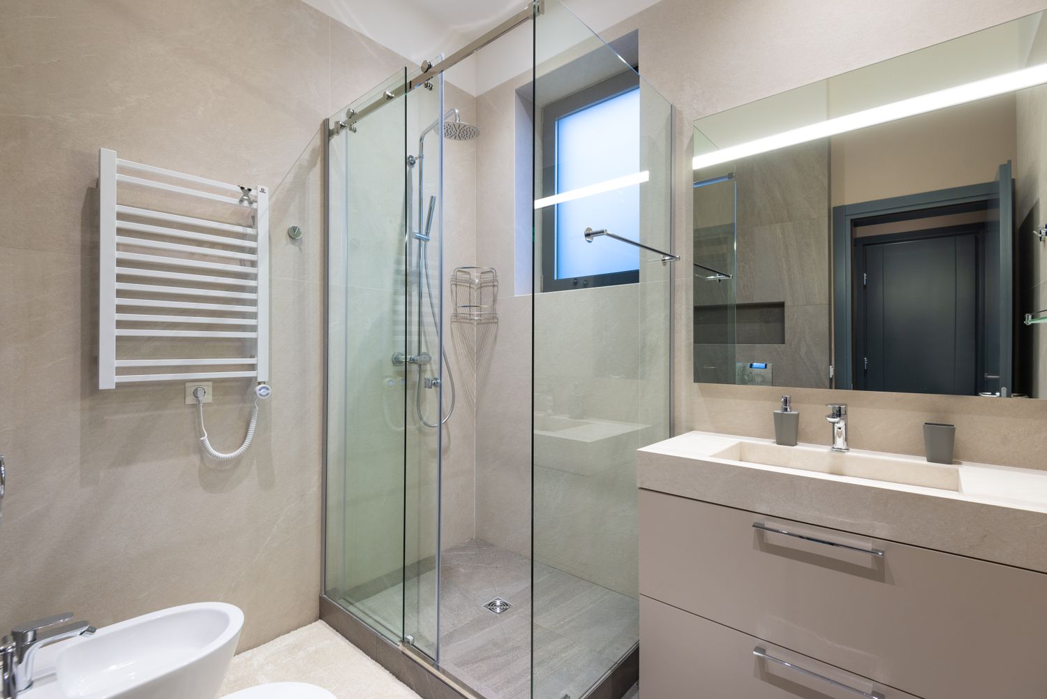 Finished bathroom with glass shower and modern sink