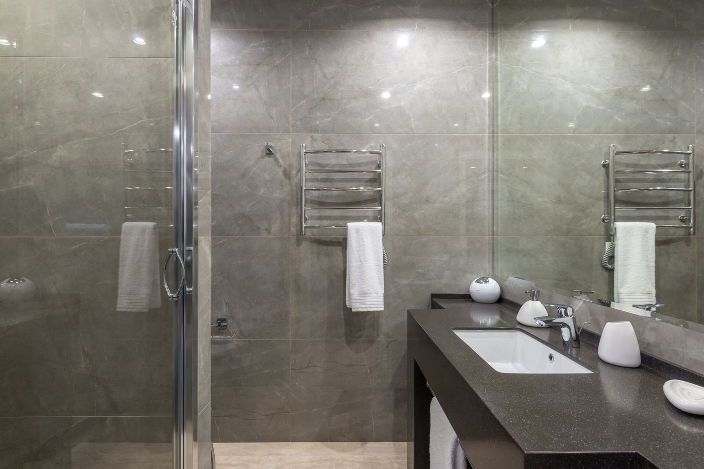 Finished tiled bathroom with mirror and sink
