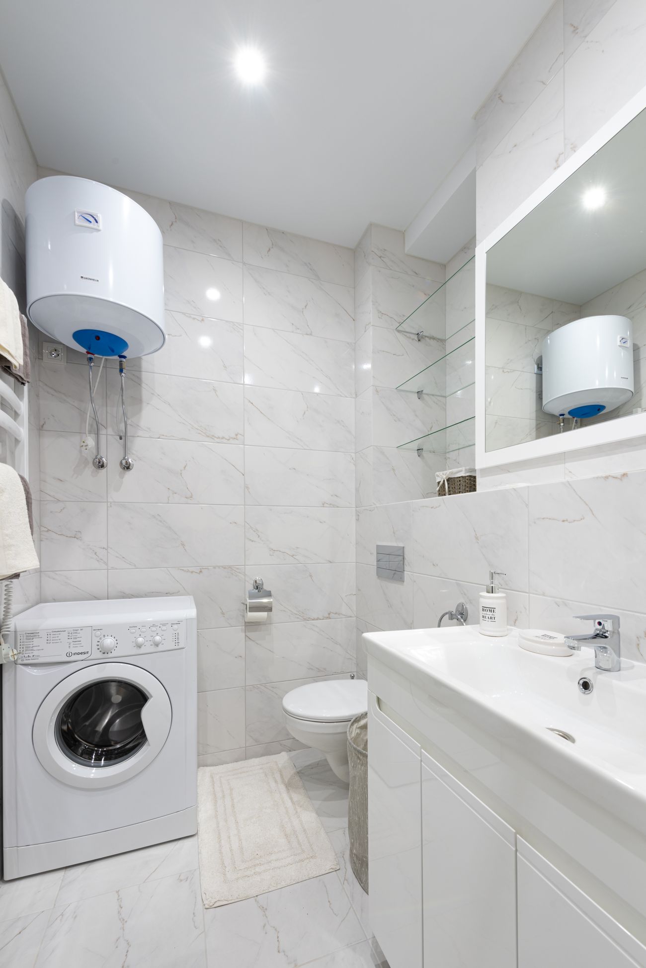 Wall-mounted water heater in a clean utility bathroom