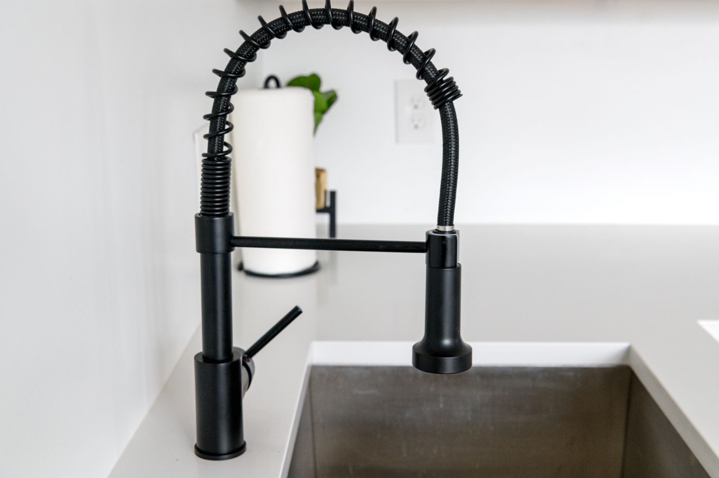 Black kitchen faucet over a sink