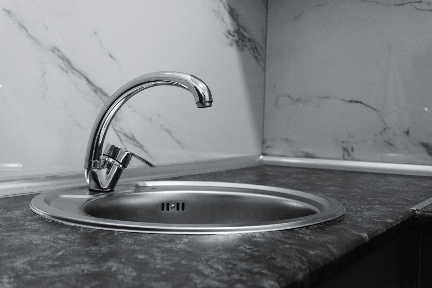 Kitchen sink with chrome faucet