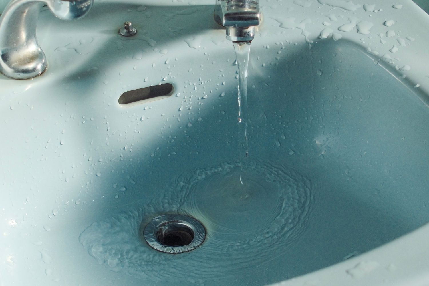 Water running into a bathroom sink